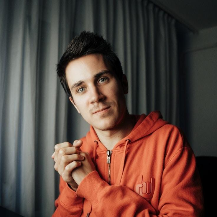 Kaveri Mehta, Lead Design Curator at Meadow Cairn Path, reviewing corporate floral arrangements